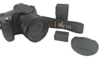 Cargador de cámara digital Sony Cyber-Shot DSC-RX10 IV 20,1 MP tapa de correa de batería Foto 1 de 4