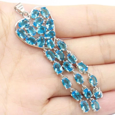 Impresionante colgante de plata de compromiso con topacio azul suizo circonita cúbica blanca para mujer Foto 1 de 2