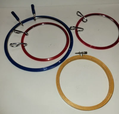4 Embroidery Hoops (2) 5" Red Plastic (1) 7" Blue Plastic (1) 5" Wood w/ Screw - Image 1 of 4