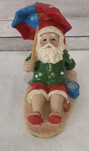 Tropischer entspannender Weihnachtsmann am Strand Statue Figur Regenschirm Urlaub Urlaub - Bild 1 von 10