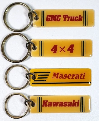 Lotto 4 Portachiavi Metallo Portachiavi Auto GMC Camion 4x4 Maserati Kawasaki - Immagine 1 di 3