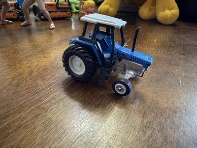 Maisto 1/64 Scale Ford Farm Toy Tractor Blue With Sliver Chrome Mint Loose C146 - Image 1 of 4