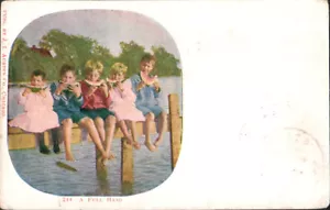 POSTAL J.I. A FULL HAND Kids Eating Watermelon on a Dock 1905 Austen Pub #244 - Imagen 1 de 2