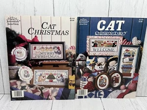 Juego de 2 libros de patrón de punto de cruz de Navidad Cat Country de colección Jeremiah Junction - Imagen 1 de 4
