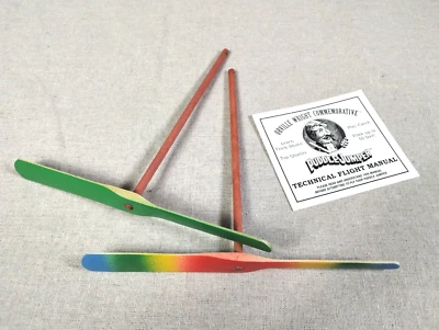 Aero Motion Puddle Jumper Hand Propelled Flying Wood Toy RAINBOW & GREEN w/book - Image 1 of 4