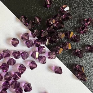 Genuine Swarovski Crystal Sparkling Beads in Amethyst February Bicone Round - Bild 1 von 9
