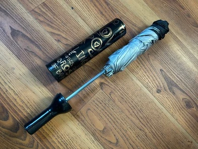 Paraguas en botella Foto 1 de 2