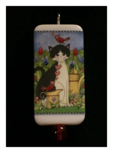 ESMOQUIN DE PRIMAVERA GATITO EN COLGANTE DE DOMINÓ DE JARDÍN - Imagen 1 de 1