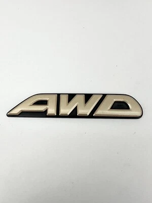 Subaru OEM 2000-2003 Outback Limited "AWD" Gold Rear Trunk Lid Emblem Logo Badge - Image 1 of 4