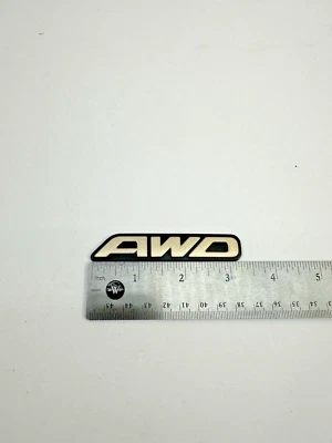 1996-1999 Subaru Legacy Trunk AWD Emblem Nameplate Badge 93022AC040 OEM - Image 1 of 4