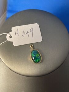 pendant,green,oval set in brass. chain 24” genuine opal