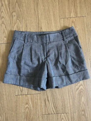 PANTALONES CORTOS MUJER EXPRESS EDITOR PATA DE GALLO A CUADROS 0 tiro medio puños Foto 1 de 3