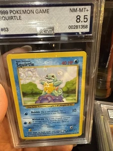 Squirtle 63/102 Base Set Unlimited 1999 Pokemon TCG Graded AGS 8.5 - Picture 1 of 3