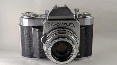 Savoyflex par Royer avec objectif SOM Berthiot 2.8/50mm, filtre Y étui et notice - Photo 1/4