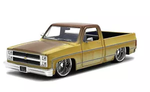 Jada 1:24 1985 Chevrolet C10 Pickup with Daytona Wire Wheels Patina Rust 35860 - Picture 1 of 2