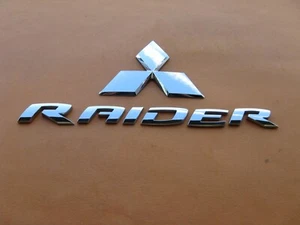 06 07 08 09 10 11 MITSUBISHI RAIDER REAR GATE EMBLEM LOGO BADGE SIGN USED A43960 - Picture 1 of 6