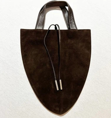 Bolso de Noche Tumi Pequeño en Cuero Marrón, Paquetes Planos, Forro Turquesa Foto 1 de 4