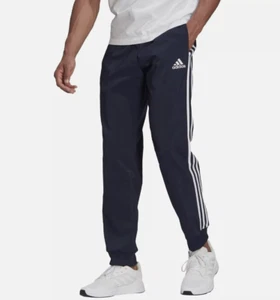 Pantalones de chándal Adidas Essentials para hombre puño cónico tejido 3 rayas XL negros - Imagen 1 de 10