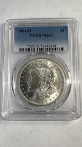 Dólar de plata Morgan 1904-O - graduado PCGS MS63 HERMOSO BRILLO COMO NUEVO - Imagen 1 de 4
