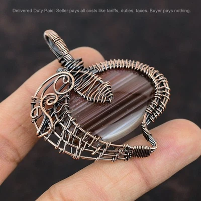 Oferta Black Friday Cobre Ovalado Botswana Ágata Piedra Alambre Envuelto Hermana Colgante Foto 1 de 4