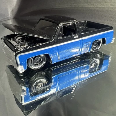 Maisto 1987 Chevy 1500 Black and Blue Firestone Squarebody Truck Hood Opens - Image 1 of 4