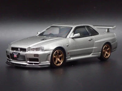 1999-2002 NISSAN SKYLINE GTR R34 VSPEC II 1:64 SCALE DIORAMA DIECAST MODEL CAR - Image 1 of 4