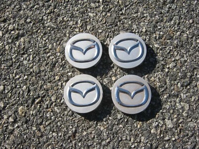 Tapacubos centrales de llantas de aleación Mazda Protoge 626 2008 de fábrica Foto 1 de 4