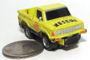 Small Micro Machine Datsun Pickup truck in Yellow marked Rescue (Worn) - Picture 1 of 3