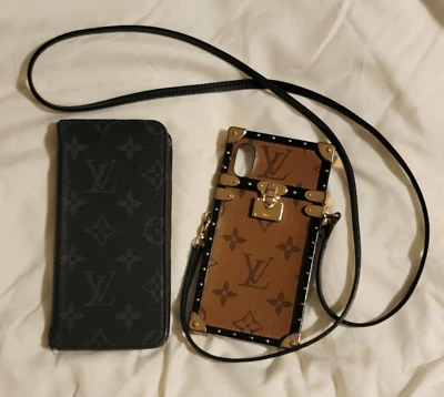 Lote de 2 fundas Louis Vuitton iPhone 7+ Folio y X/XS Eye Trunk Foto 1 de 4