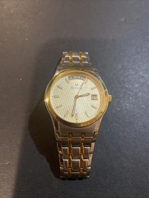 Reloj de vestir Bulova 98C60 para hombre esfera dorada champán dos tonos acero inoxidable fecha Foto 1 de 4