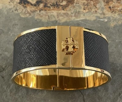 Brazalete Brazalete Tory Burch Dorado con Incrustación de Cuero Negro Foto 1 de 4