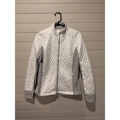 Chaqueta acolchada con cremallera Zero Restriction blanca gris rendimiento deportivo aislada Foto 1 de 4