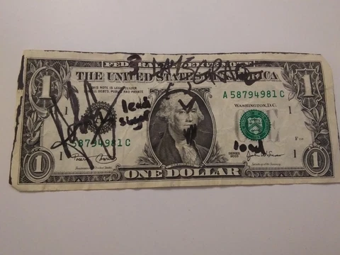 Autographed 1.00 bill from the band 3 days grace Cover