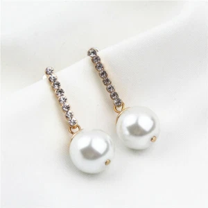 Gold tone crystal stem and hanging pearl earrings - Picture 1 of 5