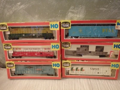 6 HO LIFE-LIKE TRAINS-THRALL DOOR BOX CARS-BENNETT, CANFOR, LUNAX, DT&I, LUMBER - Image 1 of 4