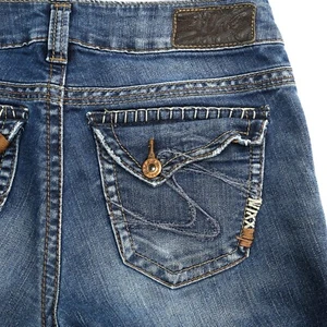 Pantalones de mezclilla elásticos con solapa excedente plateados Suki corte bota 26x30 - Imagen 1 de 9