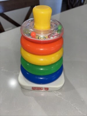 Fisher-Price Bebé Juguete Apilable Rock-A-Stack Roly-Poly Base con Anillo de Sonajero Superior Foto 1 de 4