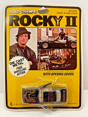 Road Champs Rocky II 1979 Pontiac transmisión automática fundido a presión 1:64 Sylvester Stallone Foto 1 de 4