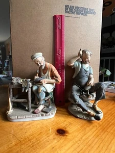 Two Vintage Shoemaker/Cobbler Figurines Hand Painted collectibles Brung - Bild 1 von 3