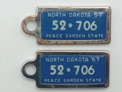 ---Pair 1957 North Dakota DAV license plate key chain tags 52-706 - Image 1 of 2