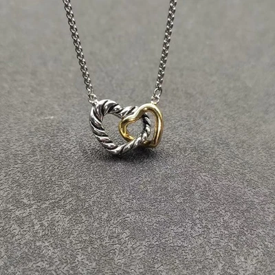 Colgante cruzado David Yurman dos colores doble corazón Foto 1 de 4