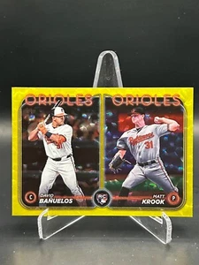 2024 Topps - #'d /50 Yellow Crackle Banuelos/Krook RC Rookie Combos Orioles - Bild 1 von 2