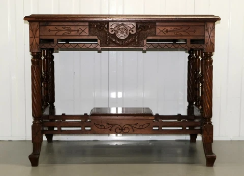 LATE 19TH CENTURY CONTINENTAL CARVED WALNUT WRITING TABLE ON LEATHER INSET TOP Cover
