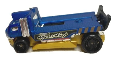 Camión de remolque HotWheels 2014 The Haulinator Speed Shop azul K28 Foto 1 de 4