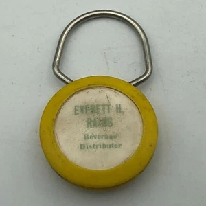 Everett Rains Distribuidor de Bebidas Llavero Publicidad Plástico FOB Llavero De Colección - Imagen 1 de 7