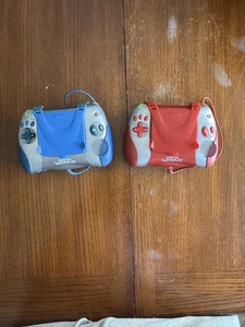 2 LEAP FROG LEAPSTER HANDHELD L-MAX GAME SYSTEMS W/ 8 GAMES & CHARGING DOCK  - Picture 1 of 9