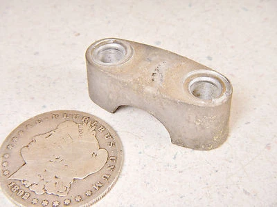 86 YAMAHA ENTICER ET340T UPPER HANDLEBAR CLAMP HALF - Image 1 of 4