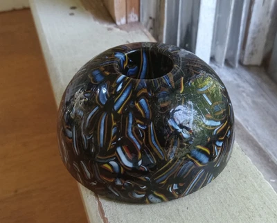 ANTIQUE BLACK ART GLASS CANDLE HOLDER PAPERWEIGHT COLORFUL PIECES INSIDE GLASS - Image 1 of 4