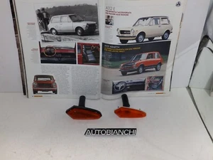 AUTOBIANCHI A. 112 ABARTH 2 SERIE DEL 73 - FANALI LATERALI DX E SX BORDO NERO - Bild 1 von 3