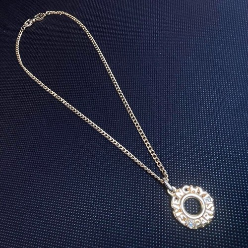 Collana con ciondolo GIVENCHY cerchio logo strass tono oro usata